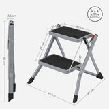 ▶ Escalera de 2 peldaños Plegable, Ancho de Marcha 20 cm, Goma Antideslizante, con asa, Carga 150 kg, Acero, Gris y Negro GSL002GY01