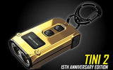 Nitecore TINI-2 SS - Llavero de acero inoxidable de doble núcleo USB-C recargable LED dorado brillante - 500 lúmenes